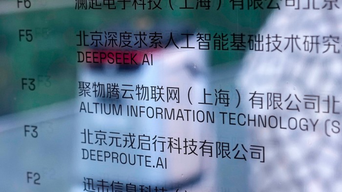 An office information board in Beijing displays company names in both English and Chinese, including &quot;DeepSeek AI&quot;