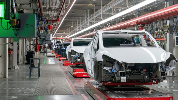 Tesla cars on an assembly line