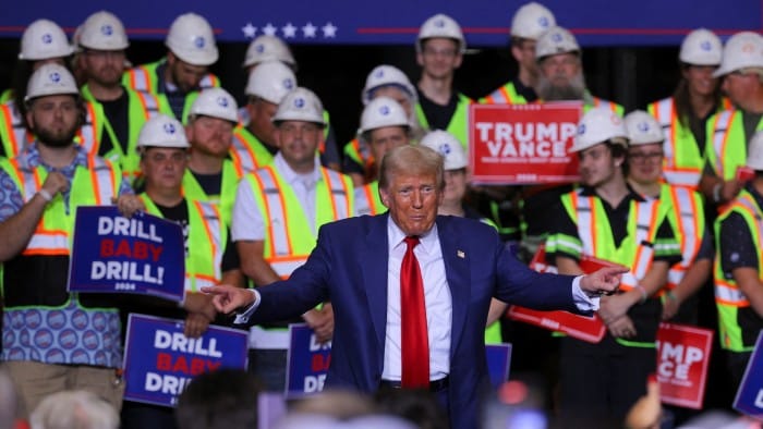 US President Donald Trump gestures during a visit to Alro Steel manufacturing plant in Potterville, Michigan