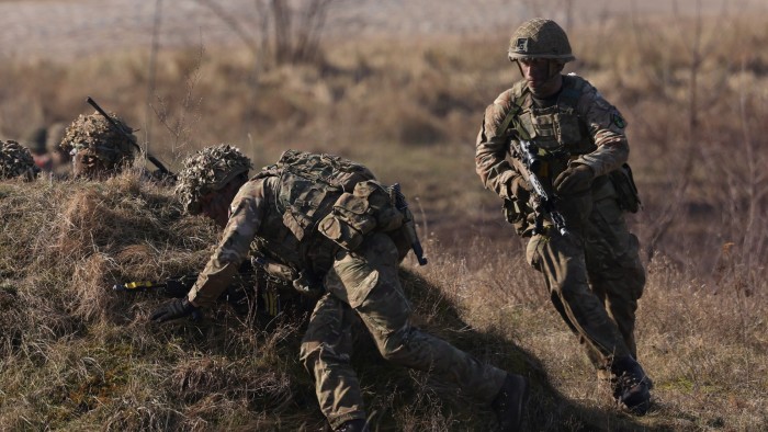 Soldiers storm an enemy position during a simulated attack during Nato military exercises in February 2024 in Poland