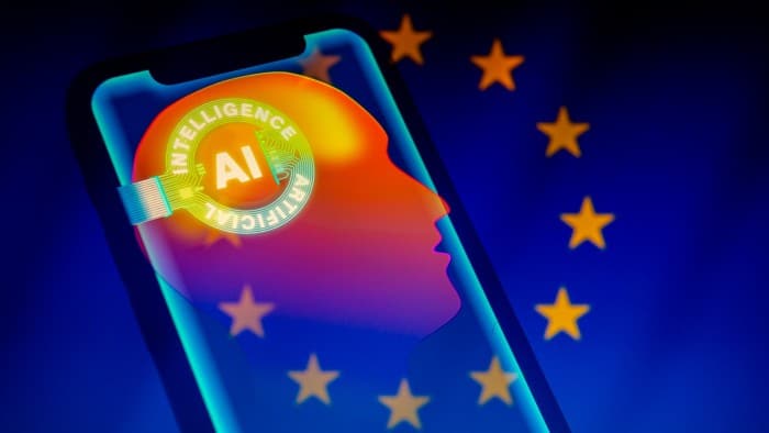 A visual representation of artificial intelligence displayed on a smartphone screen against a backdrop of the EU flag