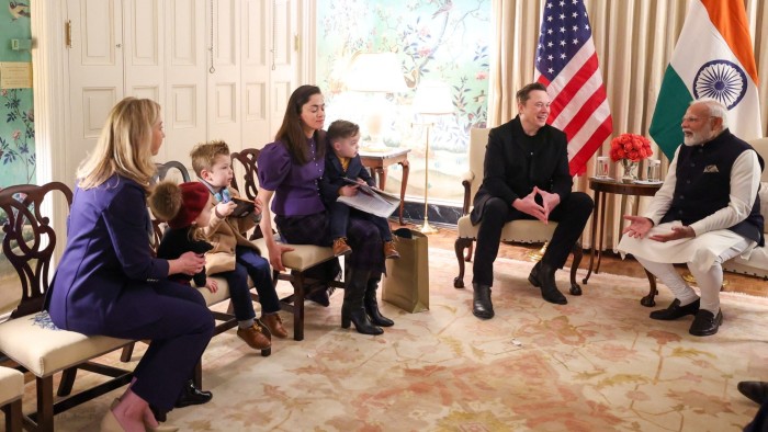 Elon Musk meets Indian Prime Minister Narendra Modi in a room with two women and three young children