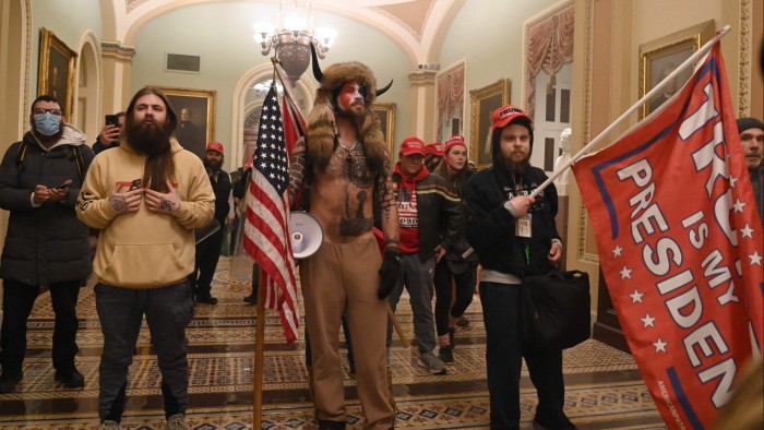 Supporters of Donald Trump enter the US Capitol building on January 6 2021, in Washington, DC