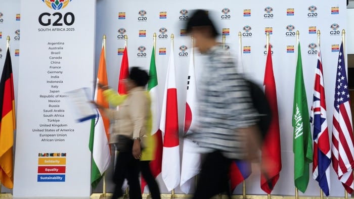 People walk at the Cape Town International Convention Centre during the G20 finance ministers’ meeting in Cape Town