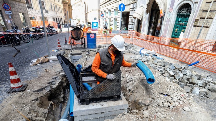 Fibre optic cables being fitted by FiberCop workers in downtown Rome