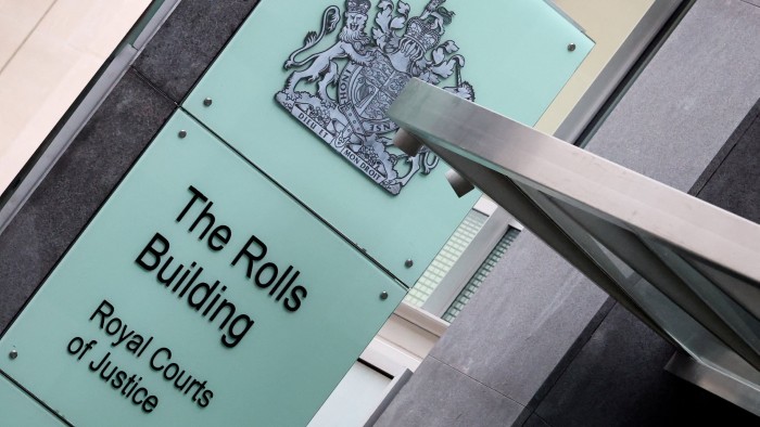 A sign for the Rolls building at London’s High Court