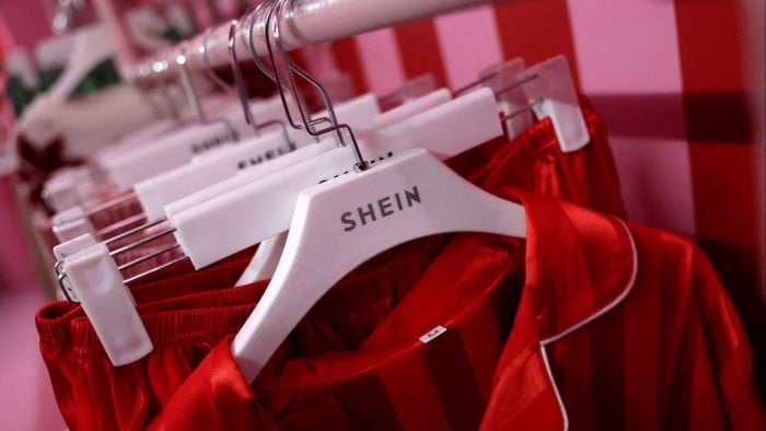 Shein clothing hangs on a rail