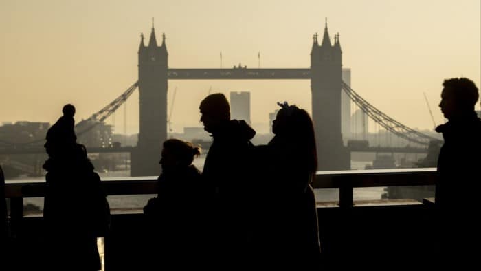 Commuters cross London Bridge