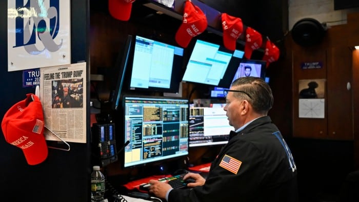 Traders work on the floor of the New York Stock Exchange