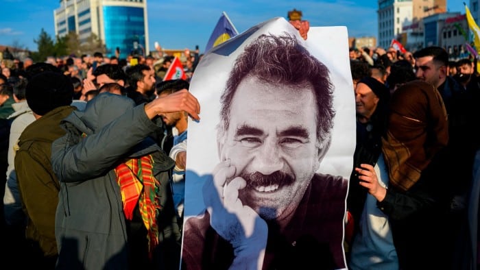 Supporters display a poster of jailed PKK leader Abdullah Öcalan in Diyarbakir, south-east Turkey, on Thursday following his call for the militant group to disarm