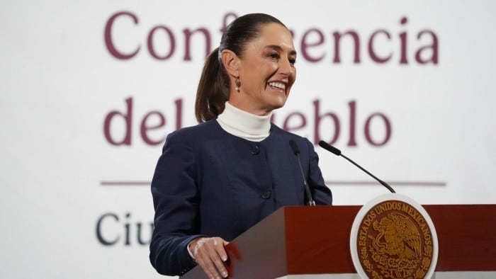 Claudia Sheinbaum smiles at a news conference