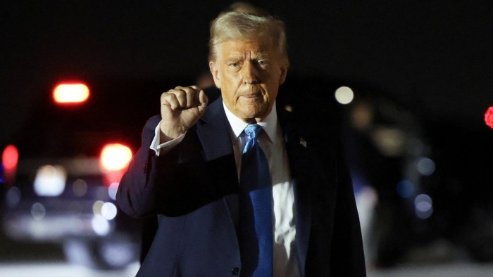 U.S. President Donald Trump pumps his fist upon his arrival in West Palm Beach