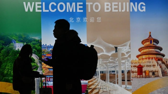 Passengers arrive at Beijing Capital International airport