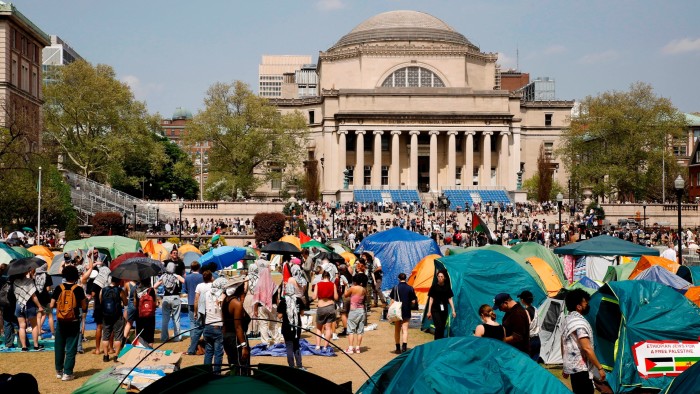 Student protesters gather inside their encampment on the Columbia University campus in April 2024