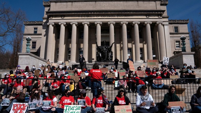 Students stage a walk-out protest at Columbia University’s Low Library steps