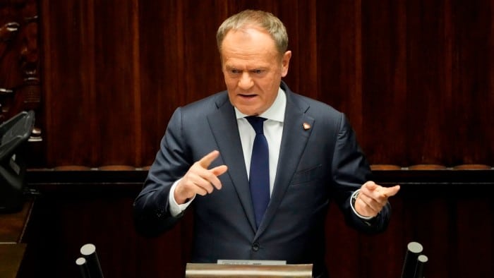 Polish Prime Minister Donald Tusk speaks at the Sejm, the lower house of parliament, in Warsaw