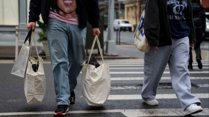 Shoppers carry bags in the Soho neighbourhood of New York