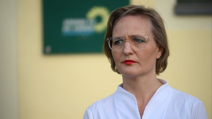 Franziska Brantner stands in front of her party's headquarters in Berlin, giving a statement