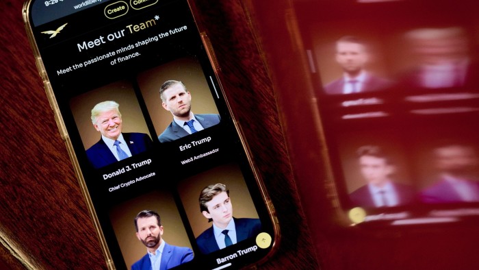 The World Liberty Financial website arranged on a smartphone, showing Donald Trump and his sons Eric, Donald Jr and Barron