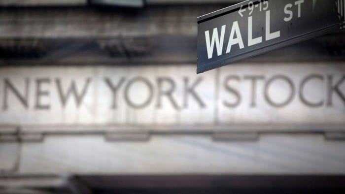 A Wall Street sign is pictured outside the New York Stock Exchange