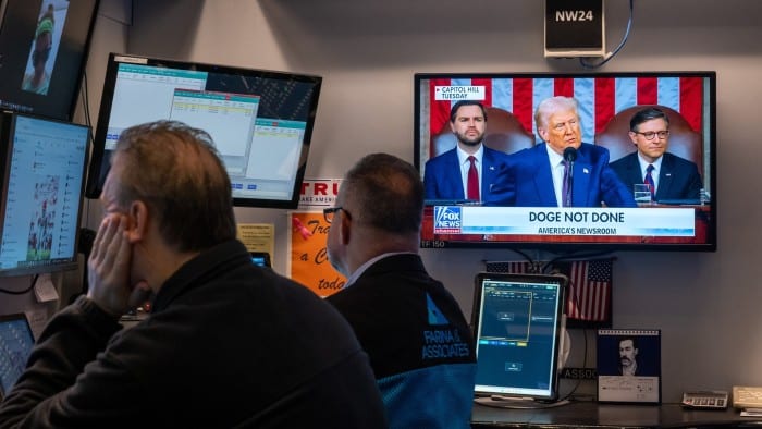 Traders work on the floor of the New York Stock Exchange