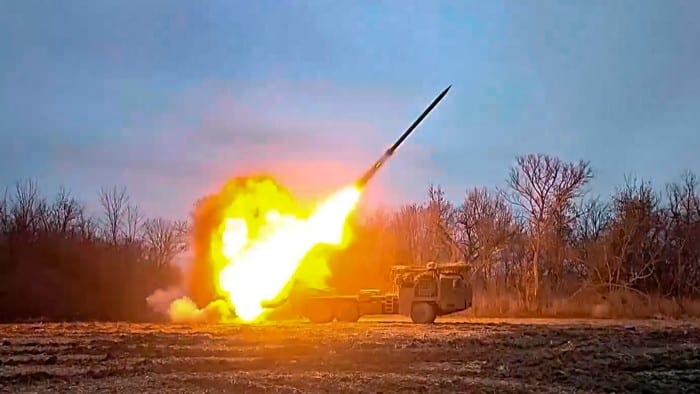 A Russian rocket launcher fires at Ukrainian positions