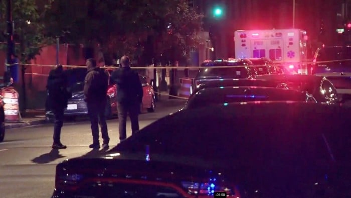 An ambulance and police vehicles outside the area where two Israeli embassy staff were shot and killed in Washington late on Wednesday