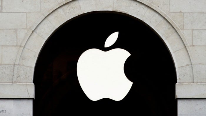 The Apple logo is prominently displayed on the facade of an Apple store