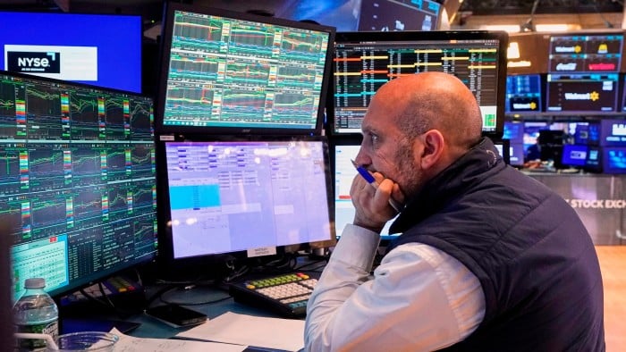 A trader works on the floor of the New York Stock Exchange