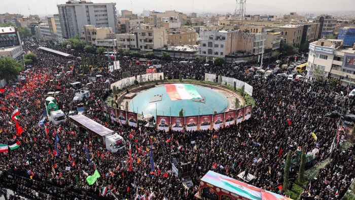 People in Tehran attend the funeral procession of Iranian military commanders, nuclear scientists and others killed in Israeli strikes on June 28