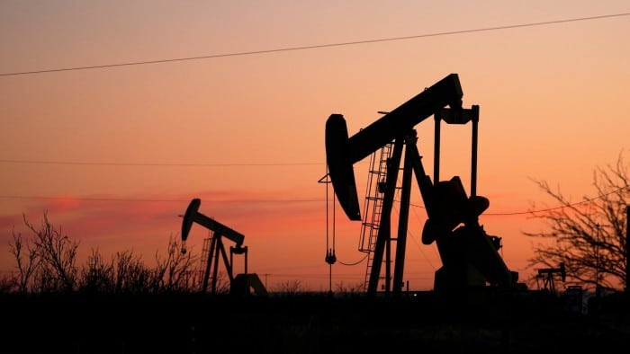 Pumpjacks are seen before sunrise in Hobbs