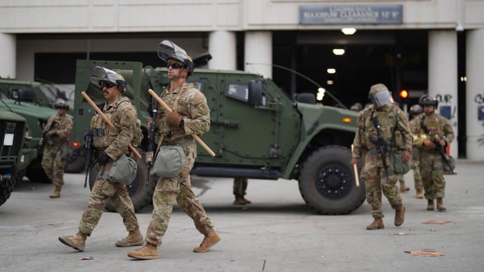 US National Guard members patrol central Los Angeles on Sunday