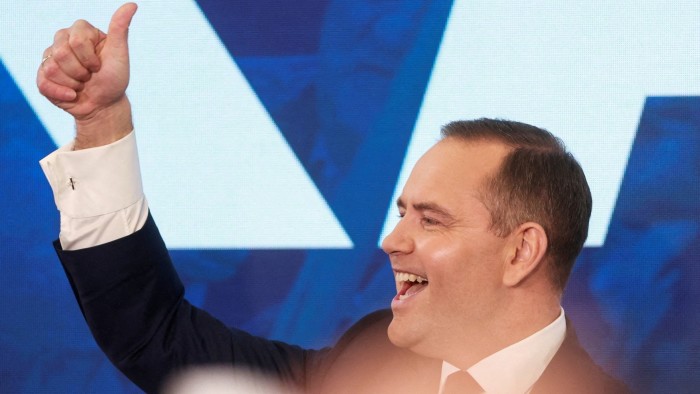 Karol Nawrocki giving a thumbs-up sign