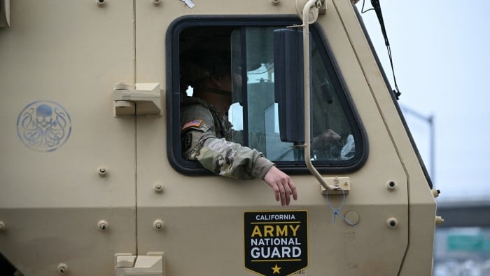 A California National Guard vehicle drives down a street in downtown Los Angeles on June 9 2025
