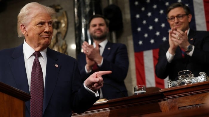 Vice-president JD Vance and Speaker of the House Mike Johnson applaud as US President Donald Trump addresses a joint session of Congress