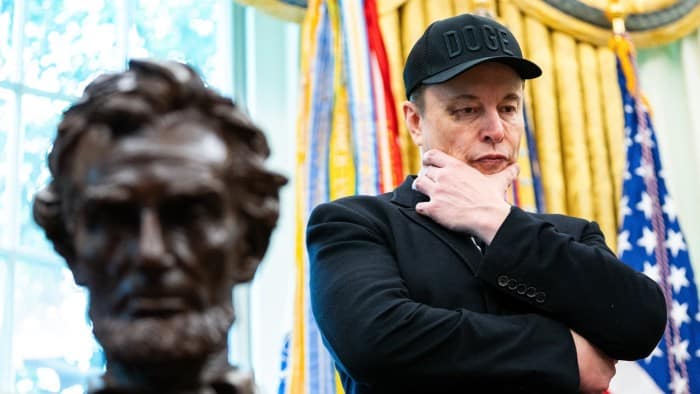 Elon Musk looks on during a news conference with US President Donald Trump in the Oval Office of the White House in Washington in May