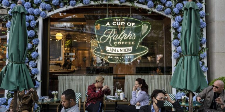 More retailers are opening coffee shops to appeal to customers who may not want to spend the big bucks—but still want a cup of joe