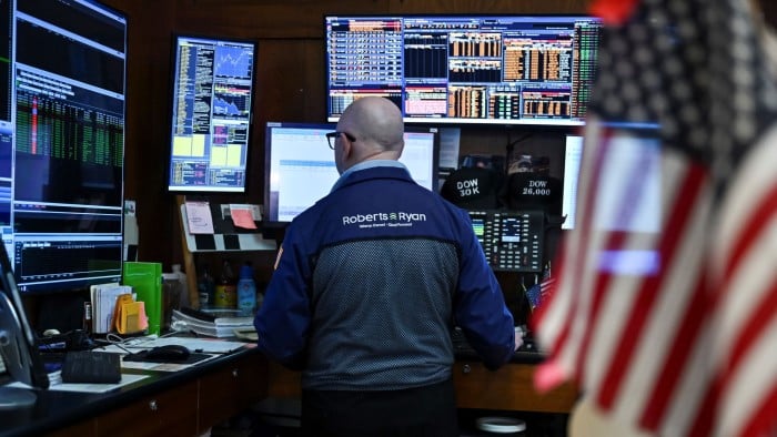 A trader works on the floor of the New York Stock Exchange