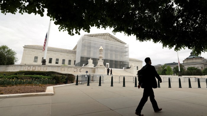 Person walks outside the US Supreme Court