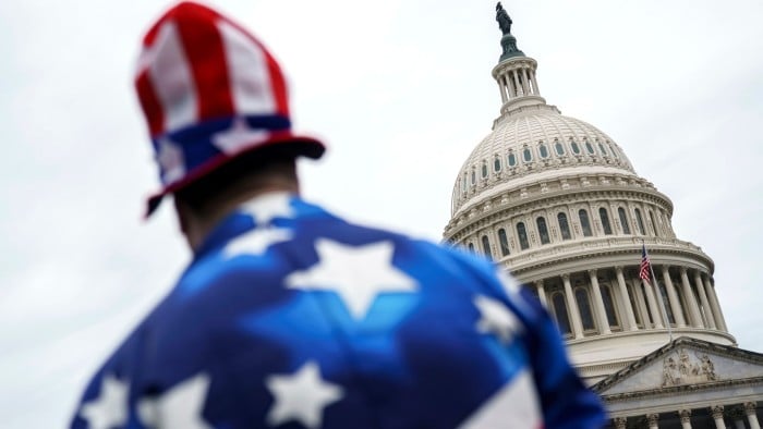 A pedestrian wearing a US flag-themed costume outside the US Capitol in Washington on July 2 2025