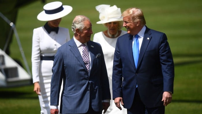 President Trump walks with Britain’s then Prince Charles (left) while First Lady Melania Trump walks with Camilla, Duchess of Cornwall (right) on day one of his first state visit on June 3, 2019 at a welcome ceremony at Buckingham Palace in central London