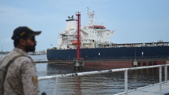 A security guard near a Russian cargo ship carrying crude oil docked at Karachi